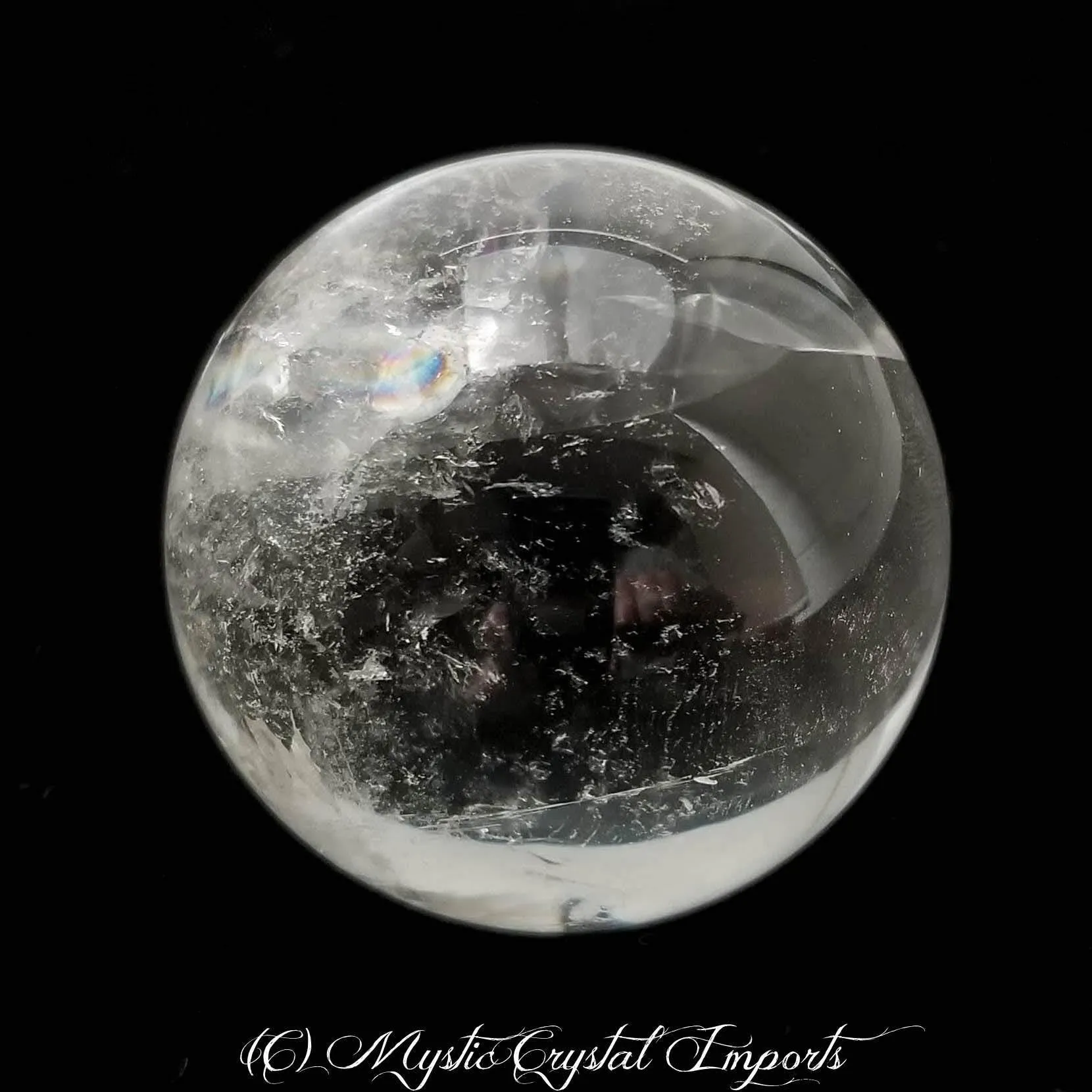 48mm Clear Quartz Crystal Sphere by Mystic Crystal Imports - Super Clear With Rainbows Inside