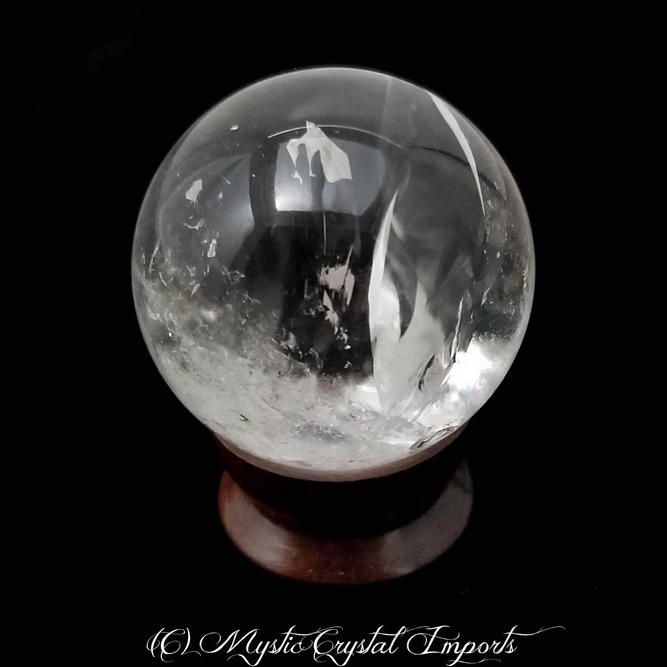 48mm Clear Quartz Crystal Sphere by Mystic Crystal Imports - Super Clear With Rainbows Inside